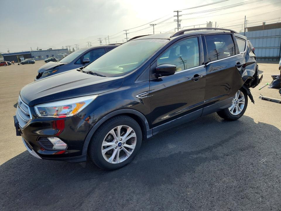 FORD ESCAPE 2018 with VIN 1FMCU0GD9JUC61076 - Photo from auction