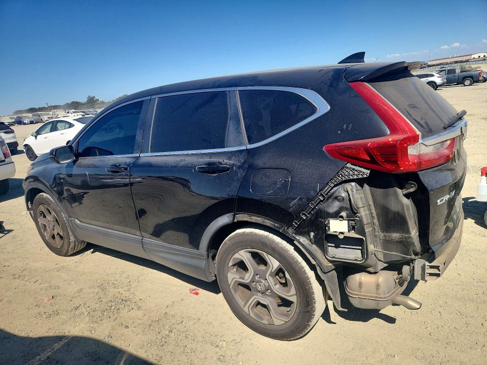 Photo 2 from auction – 2018 HONDA CR-V with VIN 7FARW1H57JE023973
