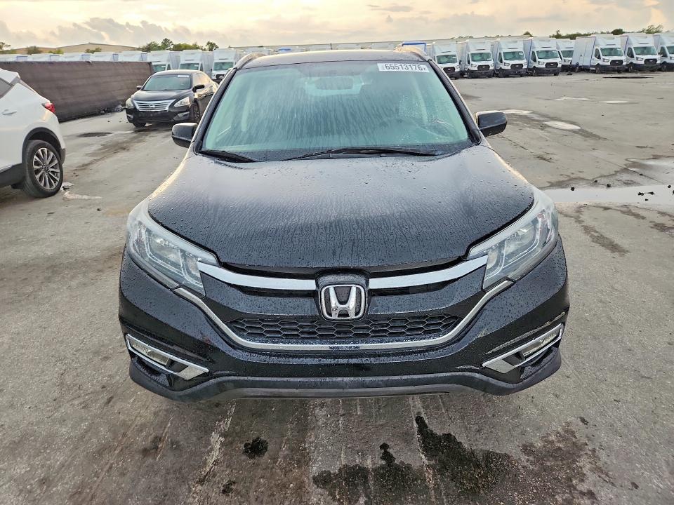 Photo 5 from auction – 2016 HONDA CR-V with VIN 2HKRM4H31GH612741