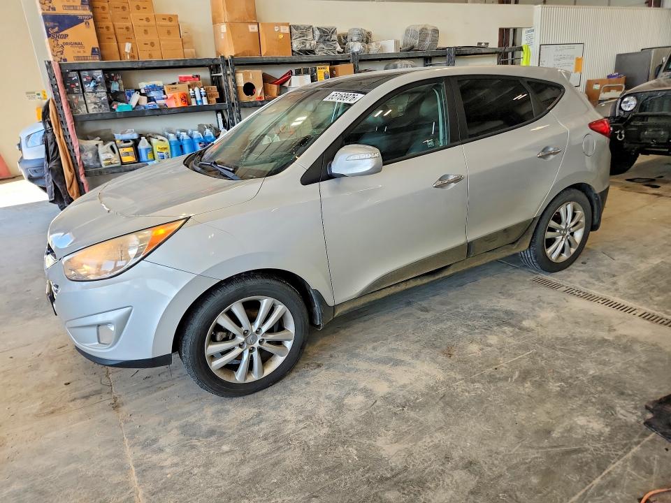 HYUNDAI TUCSON 2011 with VIN KM8JUCAC3BU226172 - Photo from auction