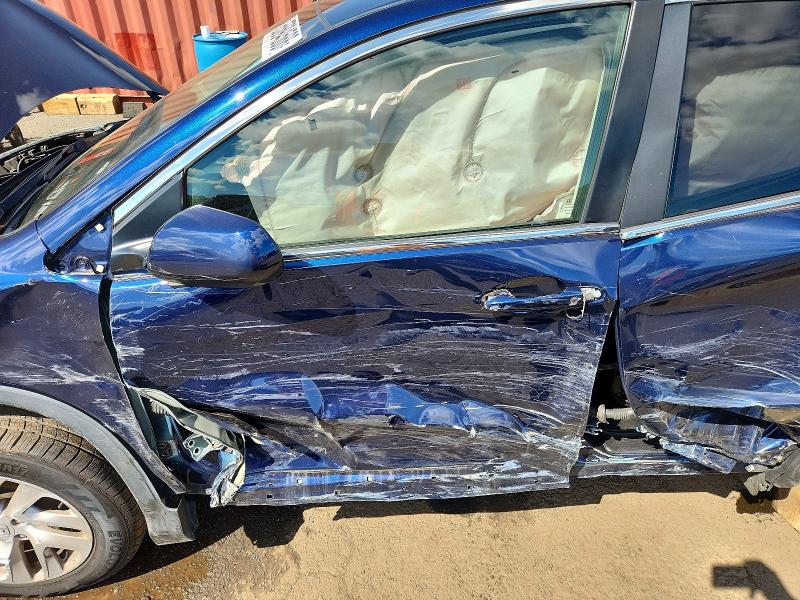 Photo 7 from auction – 2015 HONDA CR-V with VIN 2HKRM4H53FH664937