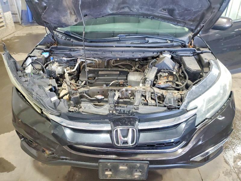 Photo 11 from auction – 2015 HONDA CR-V with VIN 2HKRM4H58FH608685
