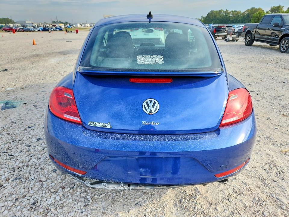 Photo 6 from auction – 2014 VOLKSWAGEN BEETLE with VIN 3VWVS7AT8EM662430