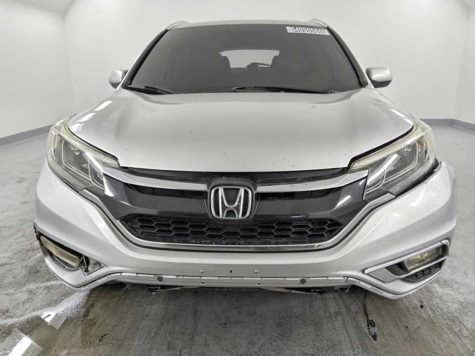 Photo 5 from auction – 2015 HONDA CR-V with VIN 2HKRM3H71FH521545