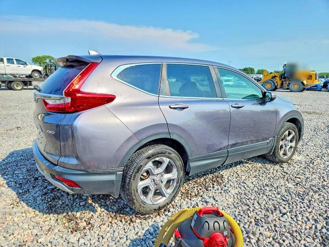 Photo 3 from auction – 2018 HONDA CR-V with VIN 7FARW2H52JE073847