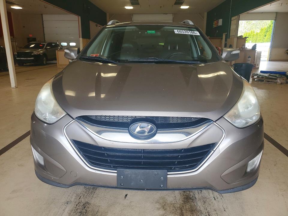 Photo 5 from auction – 2010 HYUNDAI TUCSON with VIN KM8JUCAC1AU047207