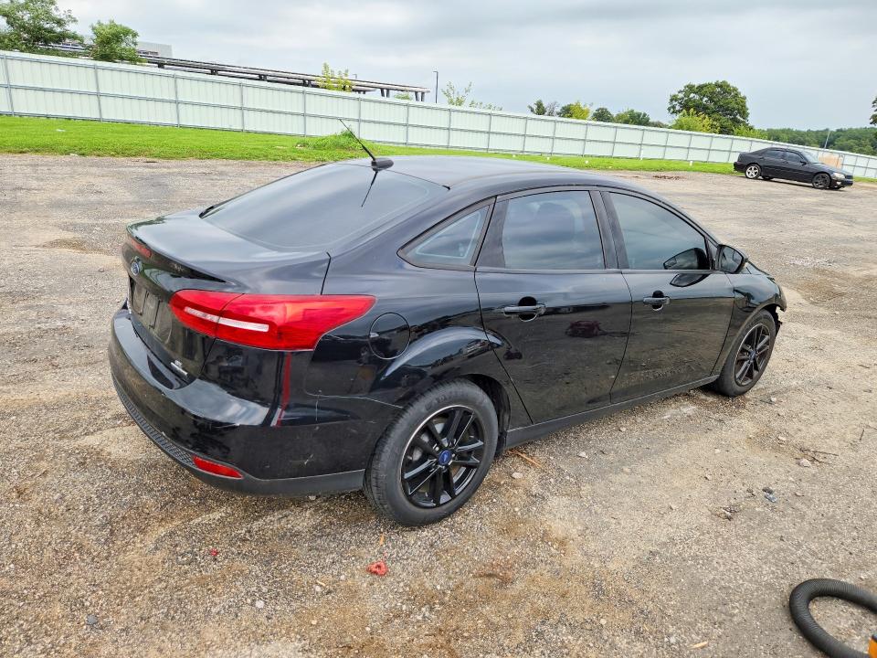 Photo 3 from auction – 2016 FORD FOCUS with VIN 1FADP3F29GL250794