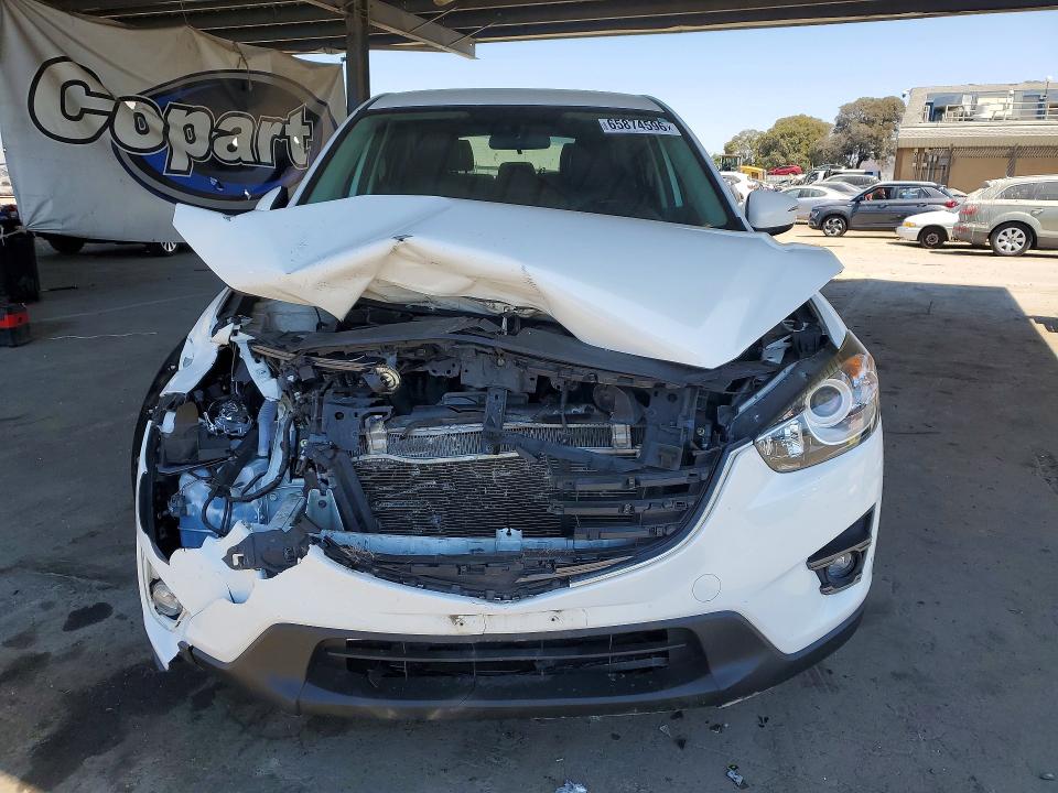 Photo 5 from auction – 2016 MAZDA CX-5 with VIN JM3KE2CY1G0921345