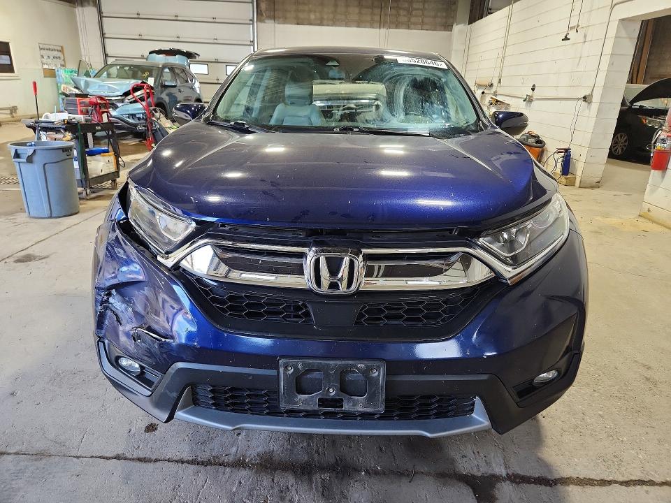 Photo 5 from auction – 2018 HONDA CR-V with VIN 7FARW2H8XJE080006