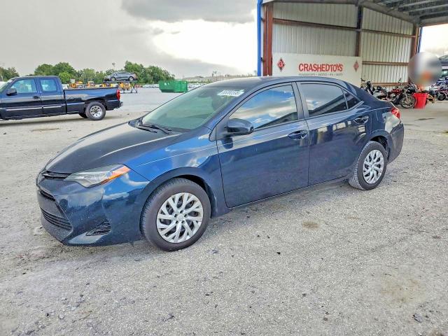 TOYOTA COROLLA 2018 with VIN 5YFBURHE0JP779991 - Photo from auction