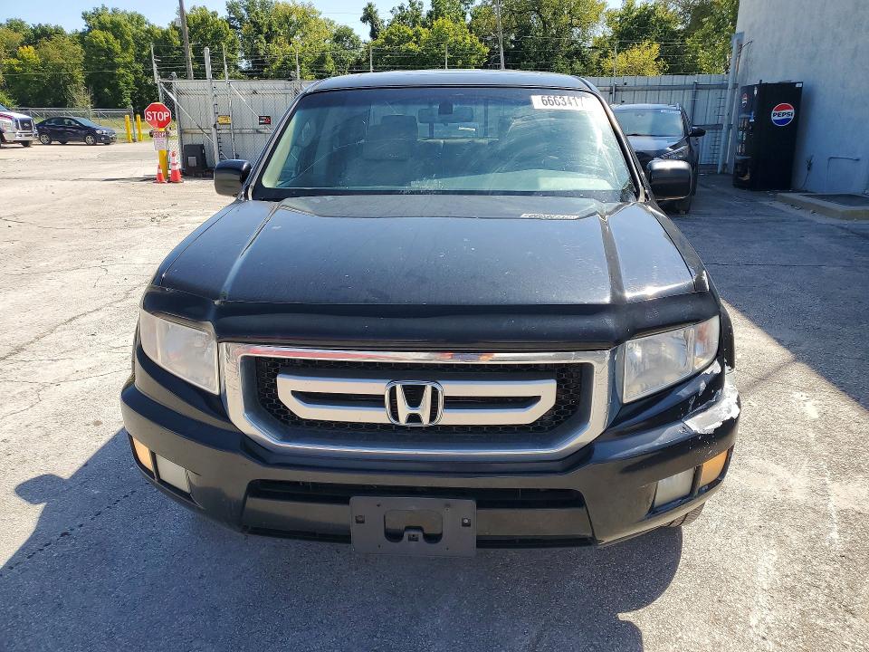 Photo 5 from auction – 2011 HONDA RIDGELINE with VIN 5FPYK1F57BB501193