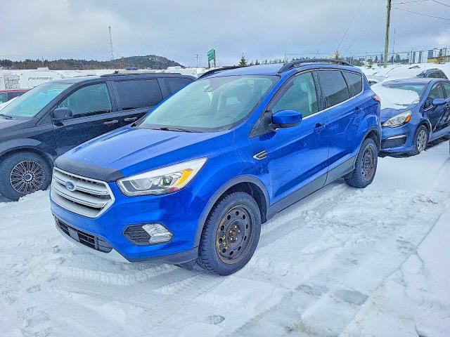 FORD ESCAPE 2018 with VIN 1FMCU9HD4JUC14105 - Photo from auction