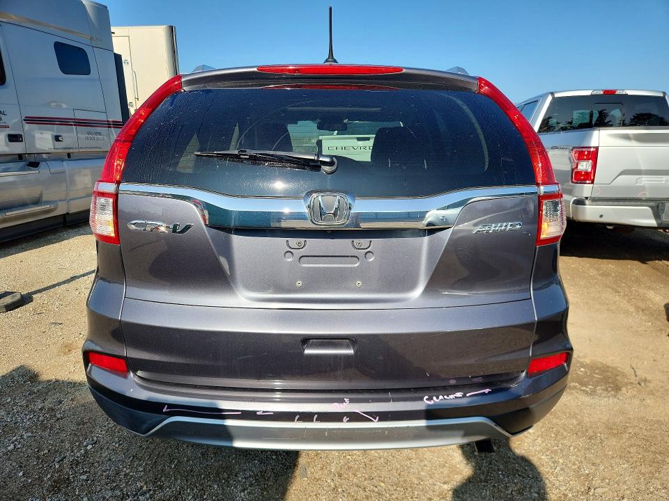 Photo 6 from auction – 2015 HONDA CR-V with VIN 2HKRM4H71FH668079