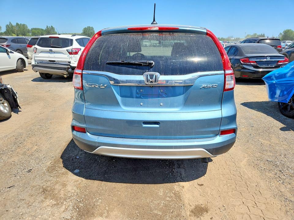 Photo 6 from auction – 2015 HONDA CR-V with VIN 2HKRM4H76FH114911
