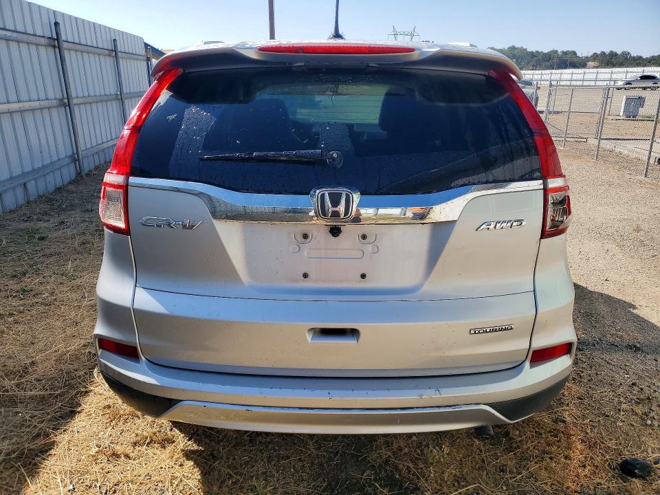 Photo 6 from auction – 2016 HONDA CR-V with VIN 5J6RM4H90GL123211