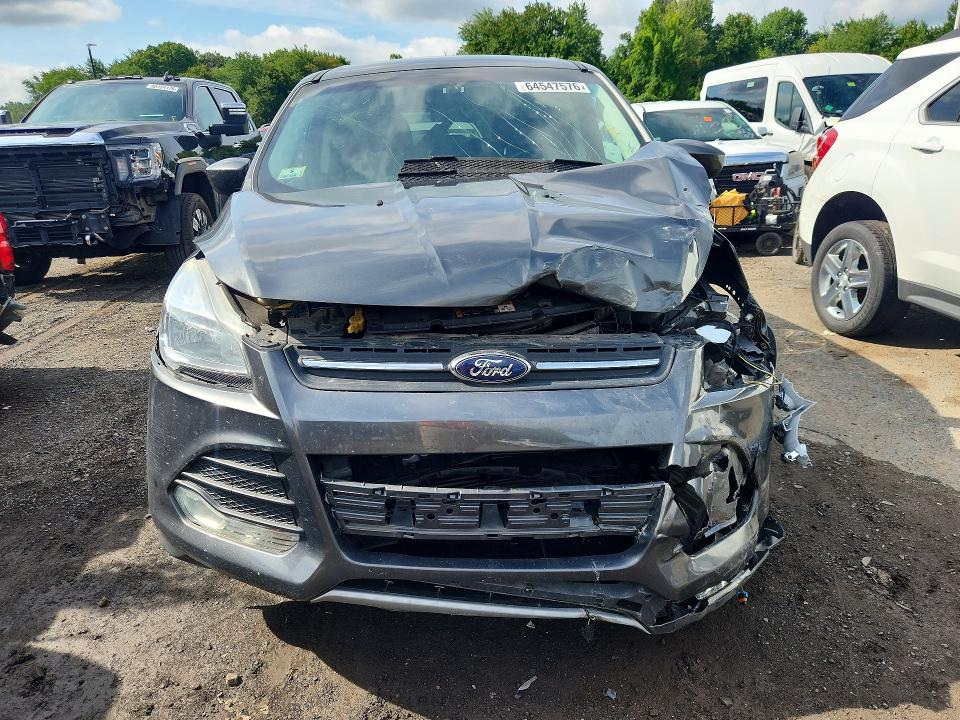 Photo 5 from auction – 2015 FORD ESCAPE with VIN 1FMCU9GX6FUA82208