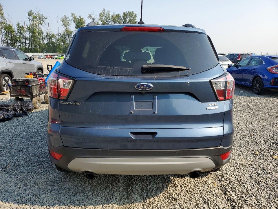 Foto 6 de la subasta – 2018 FORD ESCAPE con VIN 1FMCU9HD1JUB44885