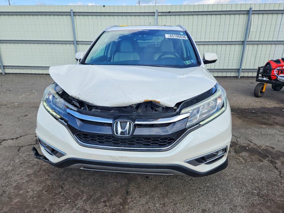 Photo 5 from auction – 2016 HONDA CR-V with VIN 5J6RM4H77GL049381