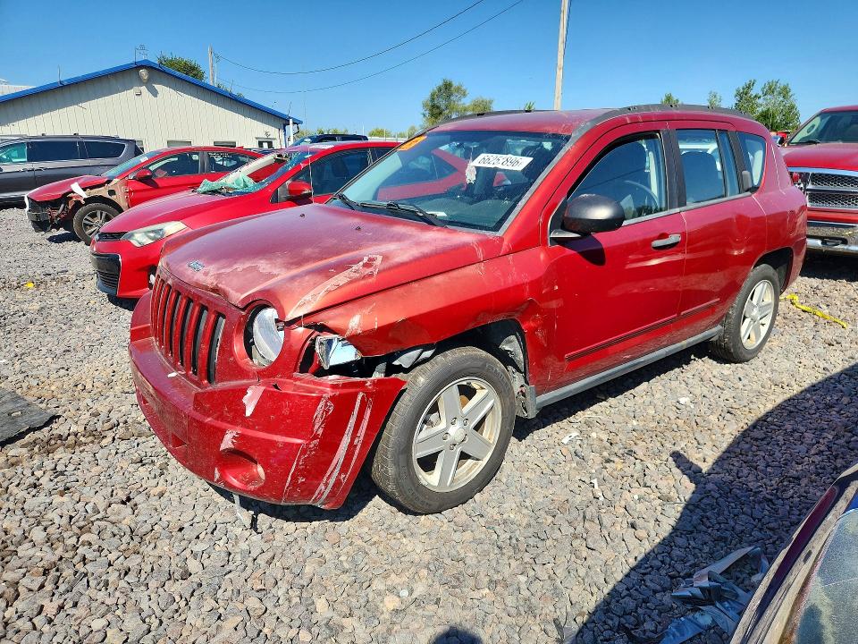 JEEP COMPASS 2010 with VIN 1J4NT4FB0AD505280 - Photo from auction