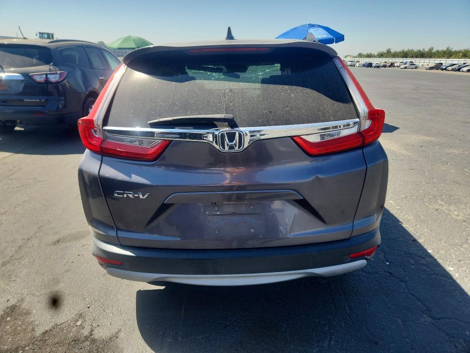 Photo 6 from auction – 2018 HONDA CR-V with VIN 7FARW1H55JE017069