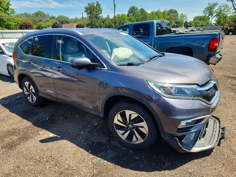 Photo 4 from auction – 2015 HONDA CR-V with VIN 5J6RM4H93FL053802