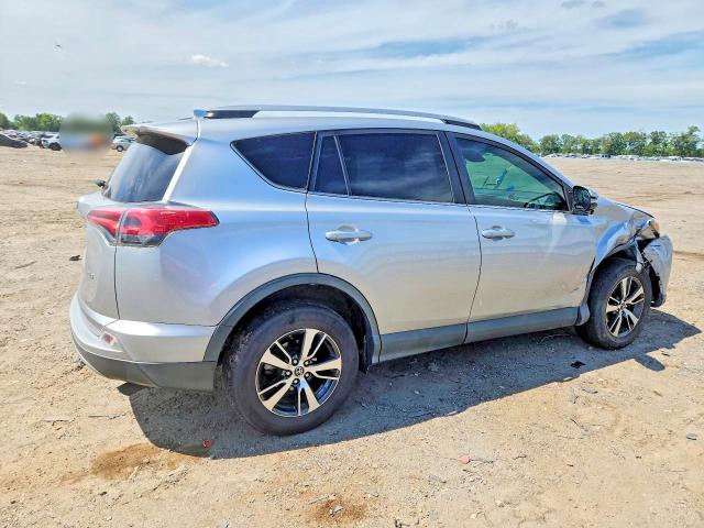 Photo 3 from auction – 2018 TOYOTA RAV4 with VIN 2T3WFREV9JW476701
