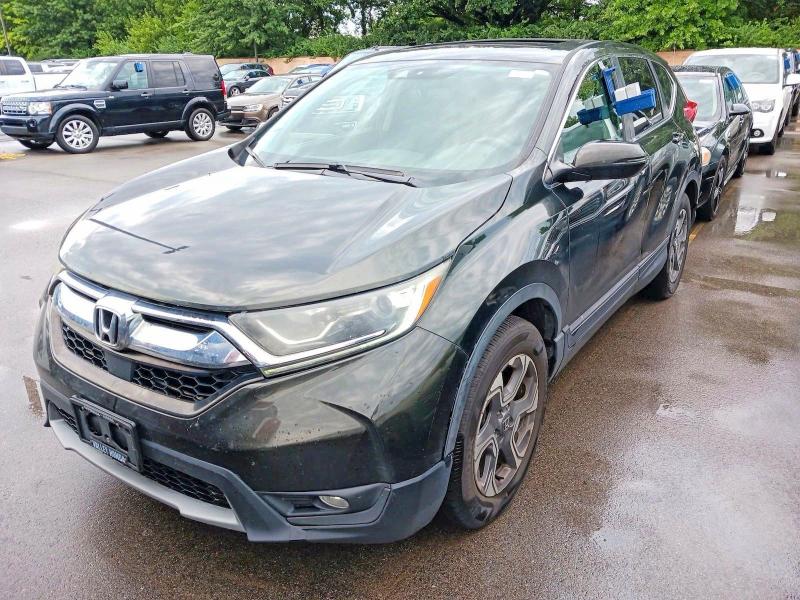Photo 2 from auction – 2018 HONDA CR-V with VIN 7FARW2H82JE010998