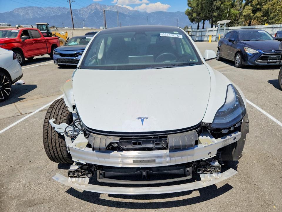 Photo 5 from auction – 2022 TESLA MODEL 3 with VIN 5YJ3E1EAXNF298314