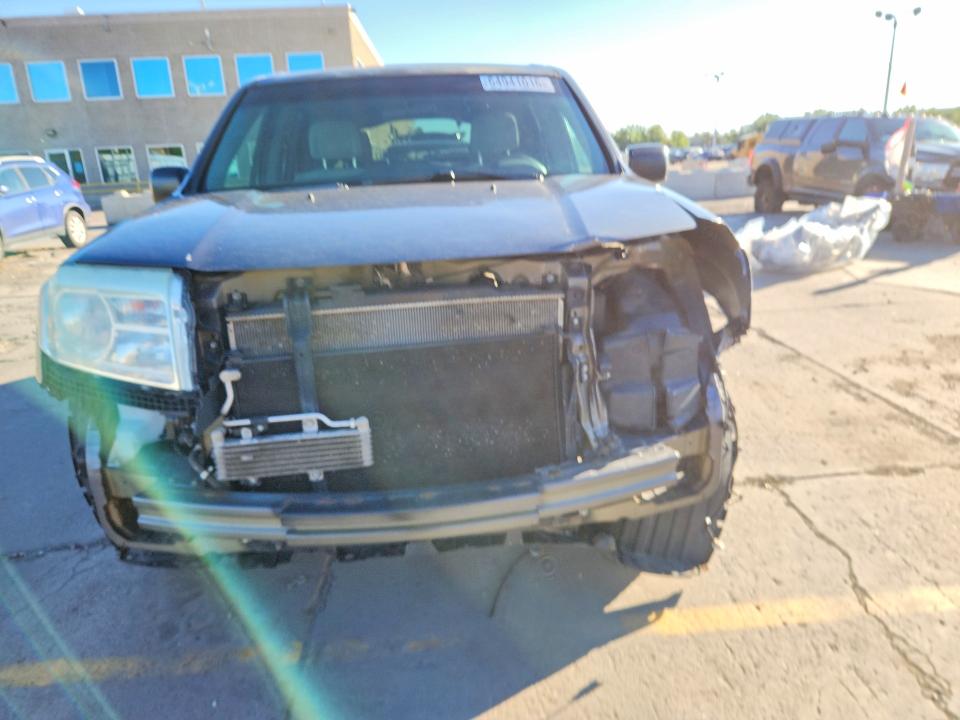 Photo 5 from auction – 2014 HONDA PILOT with VIN 5FNYF4H26EB014220