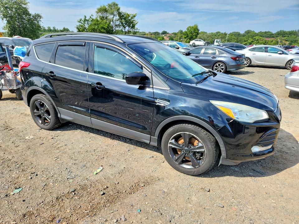 Photo 4 from auction – 2016 FORD ESCAPE with VIN 1FMCU9GX8GUA96161