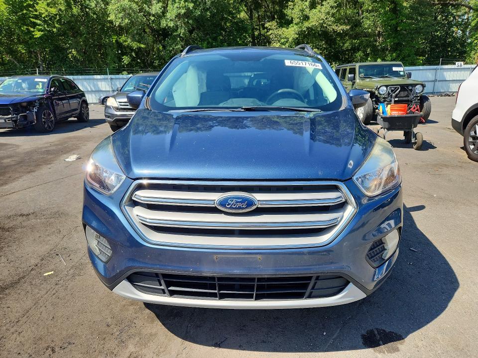 Photo 5 from auction – 2018 FORD ESCAPE with VIN 1FMCU9GD6JUC58558