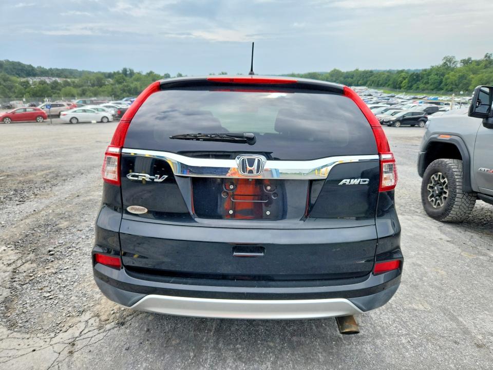 Photo 6 from auction – 2015 HONDA CR-V with VIN 2HKRM4H50FH705301