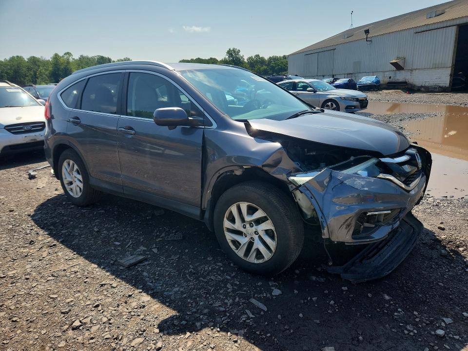 Photo 4 from auction – 2015 HONDA CR-V with VIN 2HKRM4H78FH615962