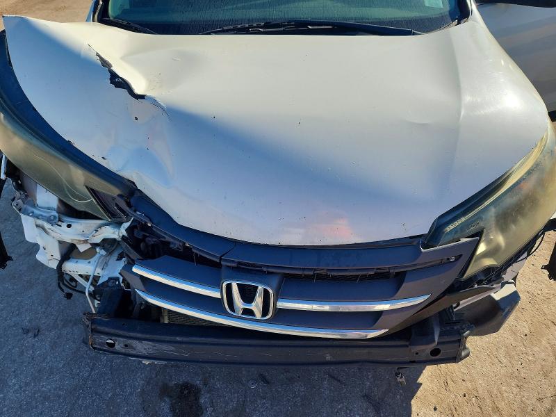 Photo 11 from auction – 2014 HONDA CR-V with VIN 5J6RM4H31EL120049