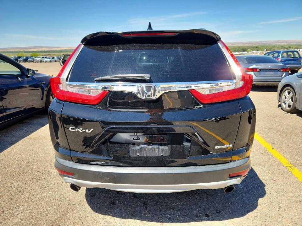 Photo 6 from auction – 2018 HONDA CR-V with VIN 7FARW1H92JE007506