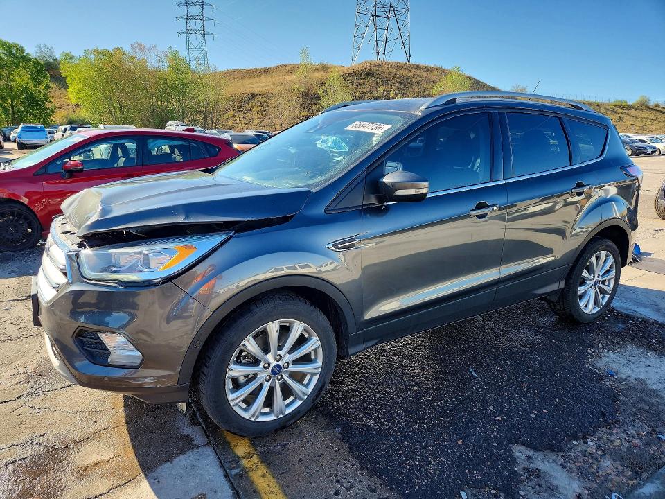 FORD ESCAPE 2018 with VIN 1FMCU9J98JUC19118 - Photo from auction