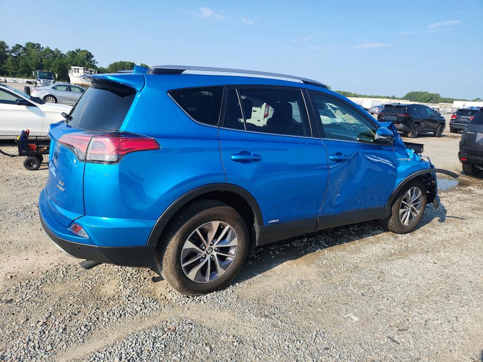 Photo 3 from auction – 2018 TOYOTA RAV4 HYBRID with VIN JTMRJREVXJD222066