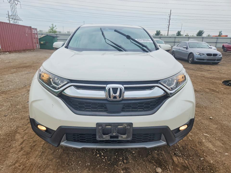 Photo 5 from auction – 2018 HONDA CR-V with VIN 5J6RW2H55JL034074