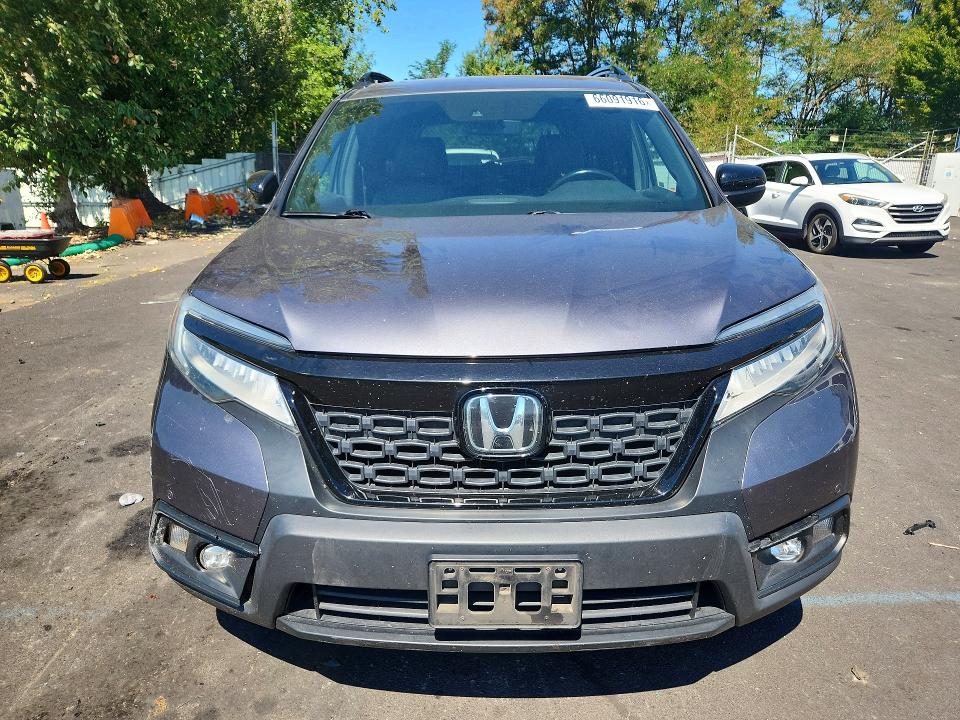 Photo 5 from auction – 2021 HONDA PASSPORT with VIN 5FNYF8H91MB025483
