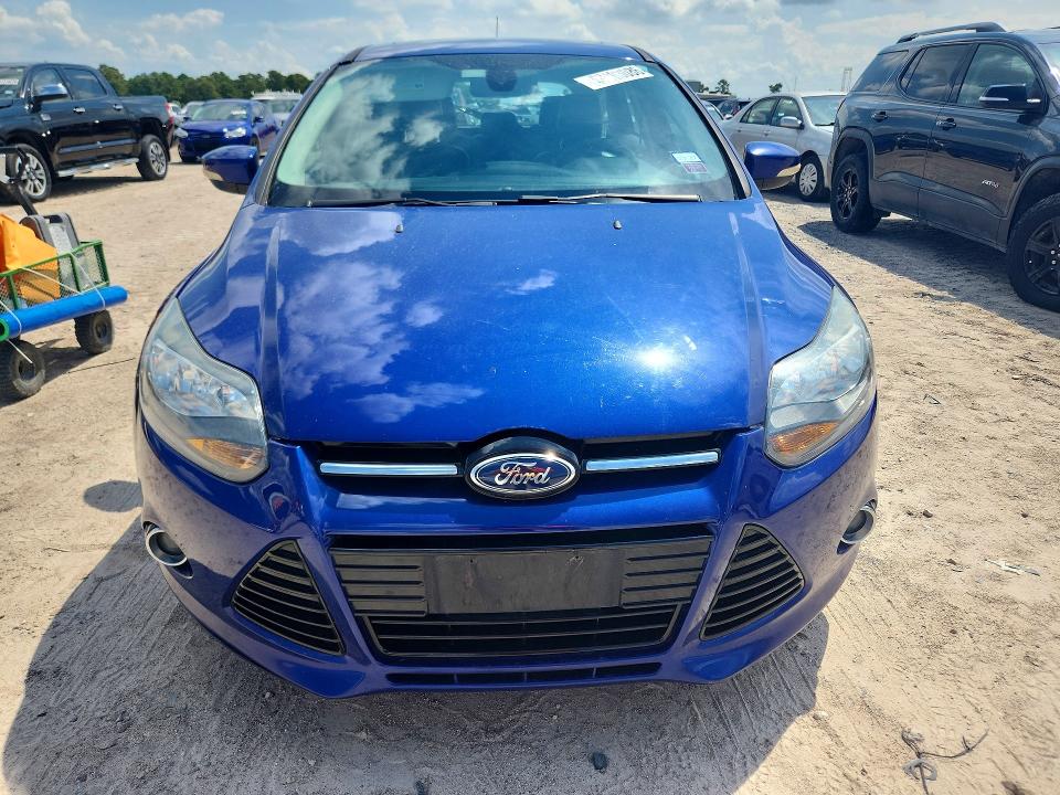 Foto 5 de la subasta – 2012 FORD FOCUS con VIN 1FAHP3N26CL320667