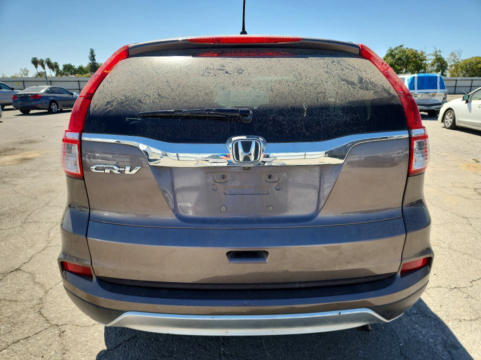 Photo 6 from auction – 2015 HONDA CR-V with VIN 3CZRM3H50FG707501