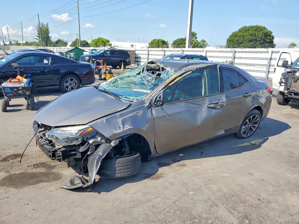 TOYOTA COROLLA 2018 with VIN 5YFBURHE5JP823127 - Photo from auction