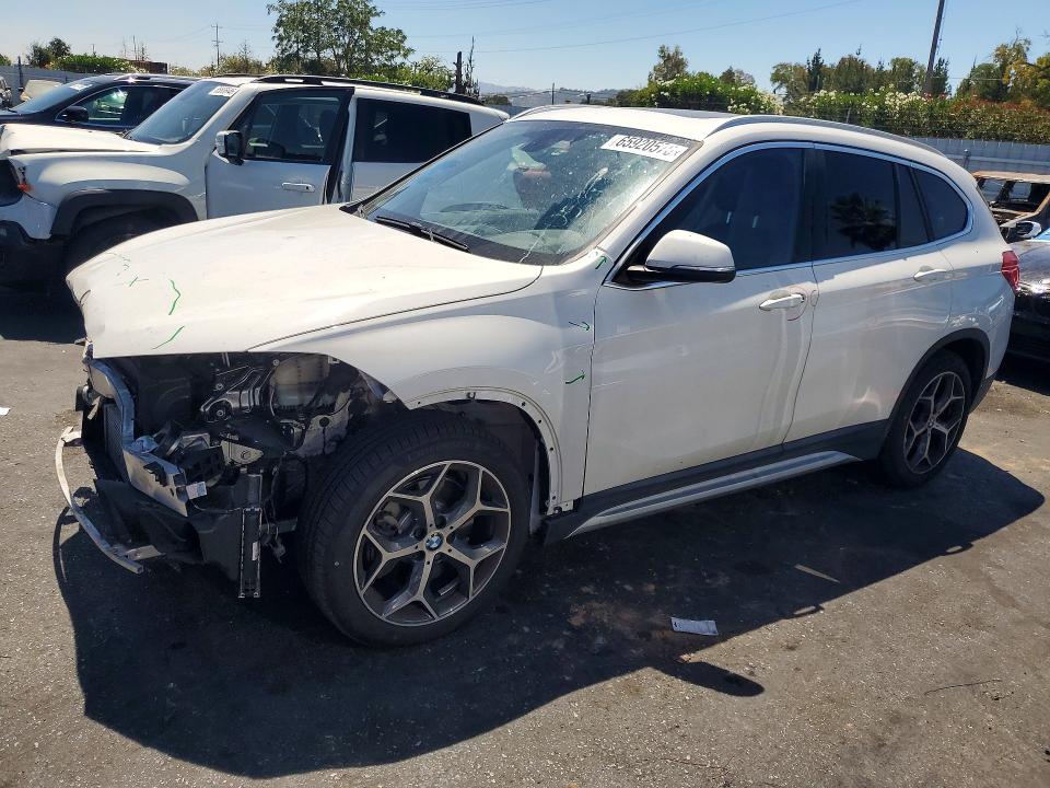 BMW X1 2018 with VIN WBXHT3C32J5K28669 - Photo from auction
