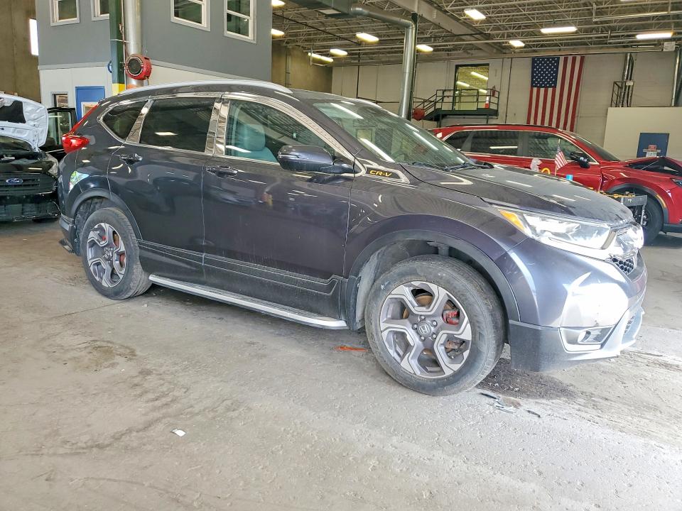 Photo 4 from auction – 2018 HONDA CR-V with VIN 7FARW2H55JE080582