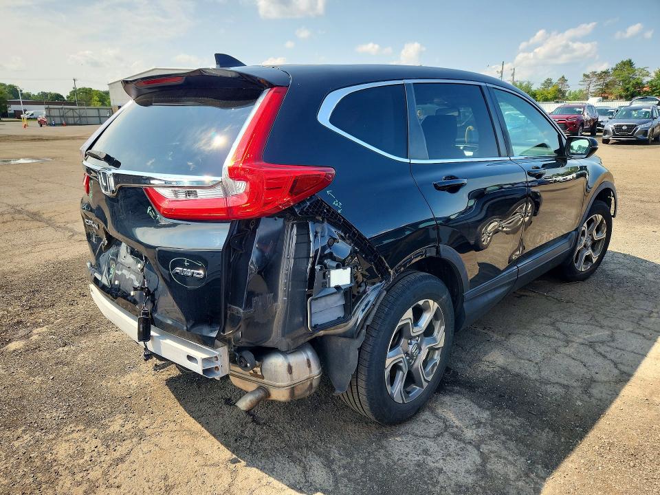 Photo 3 from auction – 2019 HONDA CR-V with VIN 2HKRW2H8XKH619979