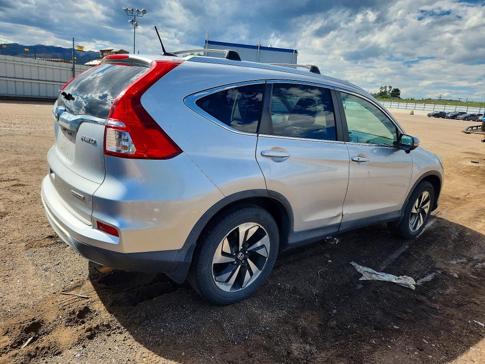 Photo 3 from auction – 2015 HONDA CR-V with VIN 5J6RM4H92FL107283