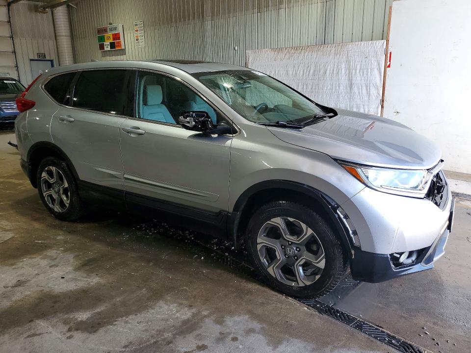 Photo 4 from auction – 2017 HONDA CR-V with VIN 2HKRW2H50HH634070
