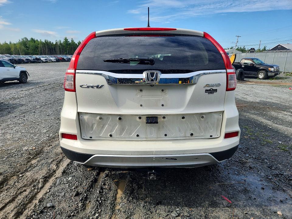 Photo 6 from auction – 2015 HONDA CR-V with VIN 2HKRM4H72FH118325