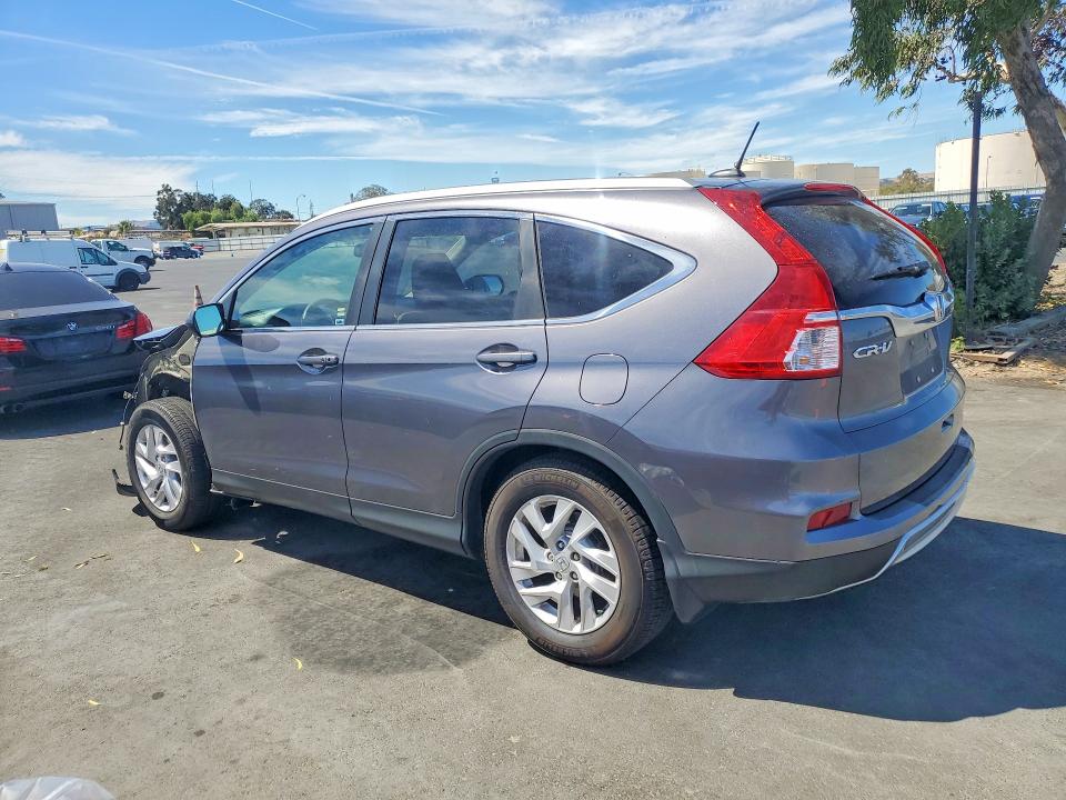 Photo 2 from auction – 2015 HONDA CR-V with VIN 2HKRM3H77FH503292