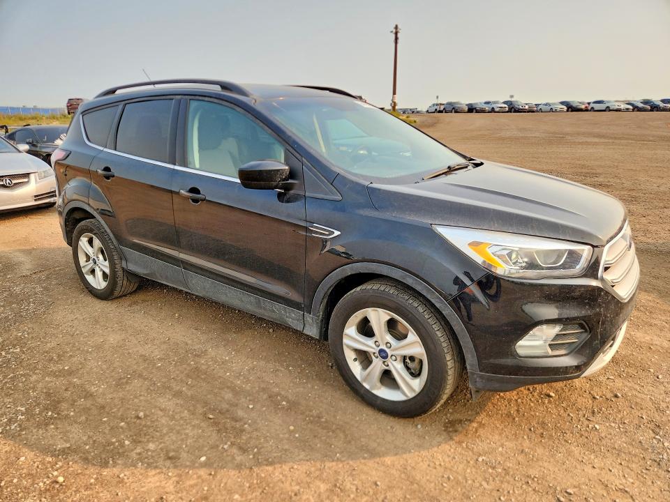 Photo 4 from auction – 2018 FORD ESCAPE with VIN 1FMCU9GD6JUC82665